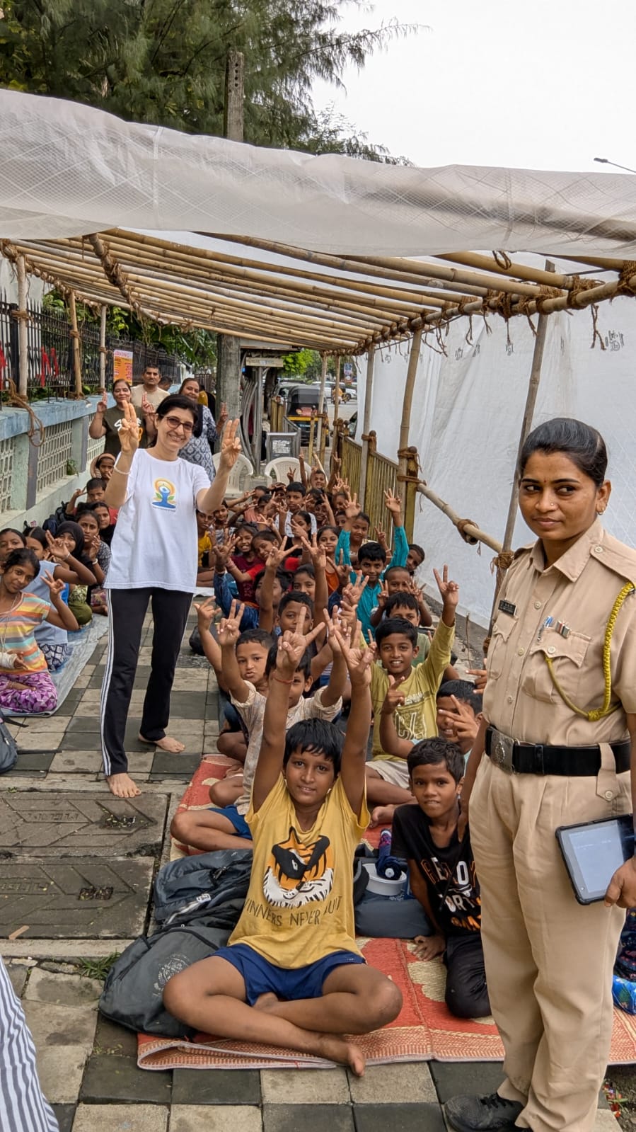 Rachna leading a community yoga session for children